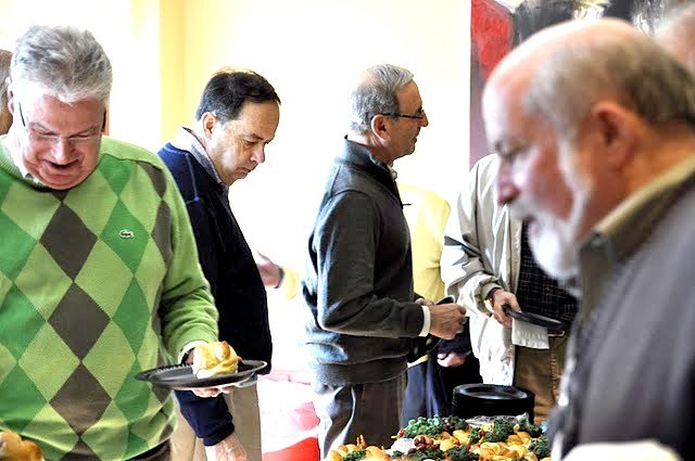 Marv Weinstein, Alan Lawit and Rich Shuman check out the buffet