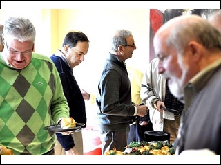 Marv Weinstein, Alan Lawit and Rich Shuman check out the buffet