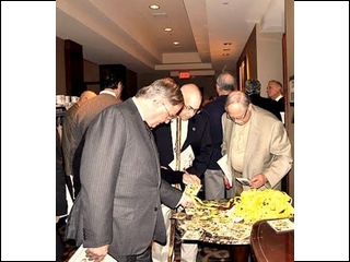 Jack Auspitz, Bernie Levin and Gerry Packman sort through the spaghetti-like pile for their IDs